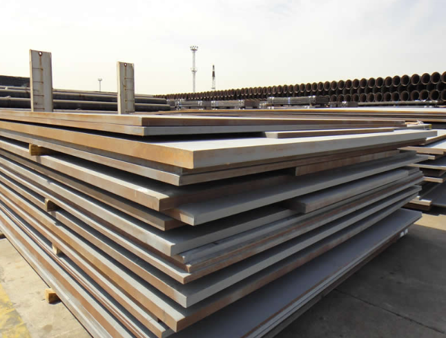 Stacked A709 50W weathering steel plates showing rust resistant surface