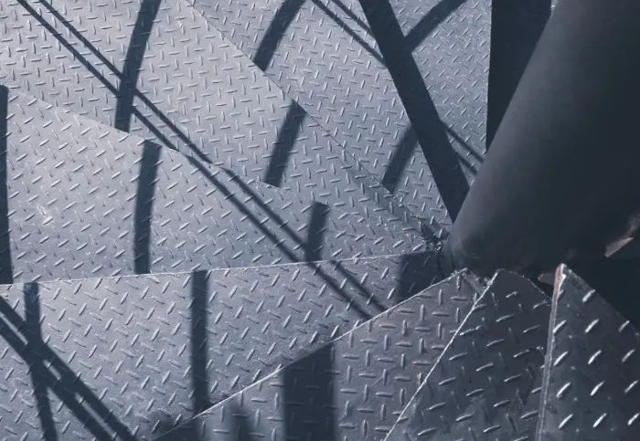 checkeredplateflooringstair CJM Steel Group Ltd Checkered steel plate with raised diamond pattern used in industrial flooring