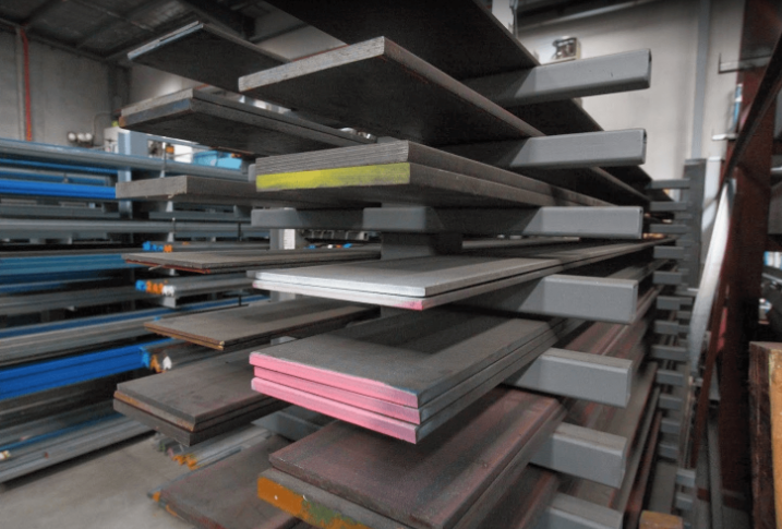 Various steel plates stacked side by side showing different thicknesses for comparison