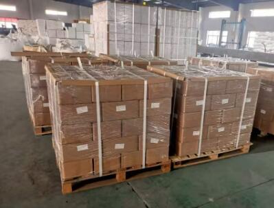 Cartons of galvanized wire strapping buckles prepared for bulk shipment